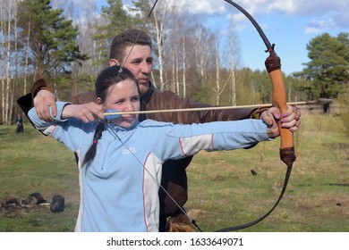 Russia, St. Petersburg 24,05,2017 A girl shoots from a bow at the festival of medieval culture "Vikings" - Shutterstock ID 1633649071