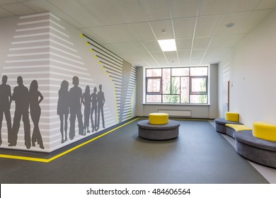 Russia, Togliatti - August 30, 2016: New public school for children. Inside in school building. Modern public school, corridor with art prints on the walls