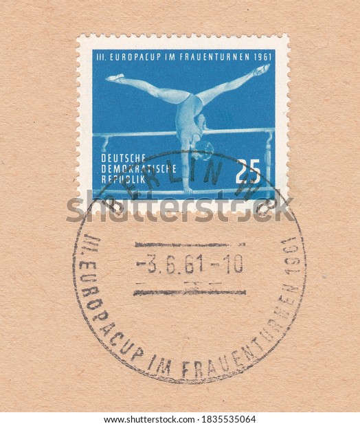 RUSSIA - TOPKI, October\
18, 2020: A stamp printed in Germany, shows Uneven parallel bars,\
3rd European women\'s gymnastics Championships. Postmark of Berlin,\
circa 1961