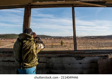 Russia and Ukraine. Ukraine conflict. Information war. USSR
Man look through binoculars. Border between Russia and Ukraine