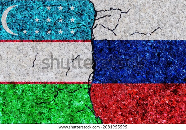 Russia and Uzbekistan painted flags\
on a wall with grunge texture. Russia and Uzbekistan conflict.\
Uzbekistan and Russia flags together. Russia vs\
Uzbekistan