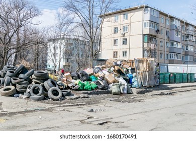 Russia, Vladivostok, 03/23/2020. Garbage Dump In Residential Area. Dirt And Stench, Environmental Issues. Mud In The Streets. City Infrastructure And Its Problems. Bad Quality Of Life.