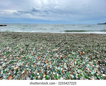 Russia. Vladivostok, coastal strip of emerald glass pebbles and clear water of the Glass (Styeklyannaya, Kitovaya) bay in summer - Shutterstock ID 2255427225