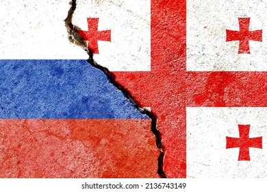 Russia VS Georgia national flags isolated on broken wall background, abstract Russia Georgia politics conflicts concept