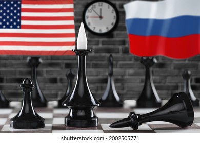 Russia Vs USA, Chess Like Geopolitics Game. Flags Of United States And Russian Federation And Chessboard.