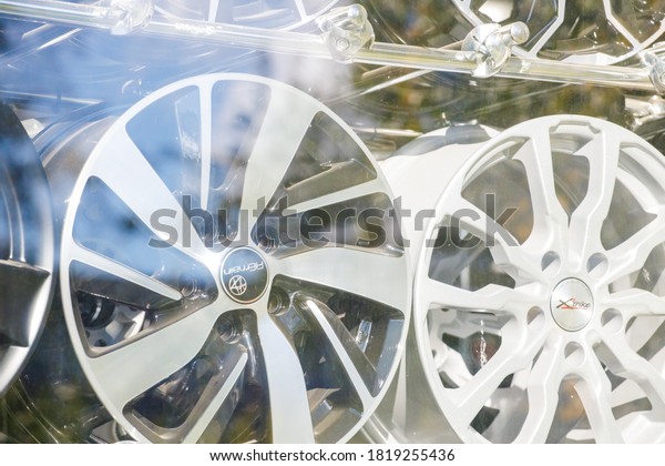 Russia Vyborg. 09.09.2020 Car rims in the shop\
window behind the glass.