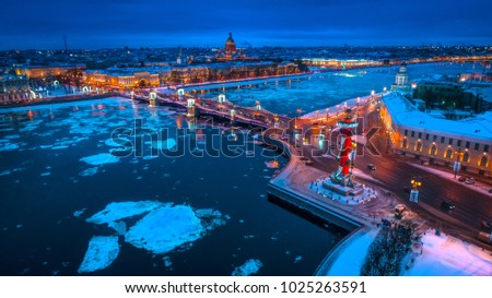 Russia. Winter in Russia. St. Petersburg. Night city. Ice floats along the Neva River. Evening Petersburg. Panorama of Petersburg. The bridge across the Neva. Panorama of Russia.