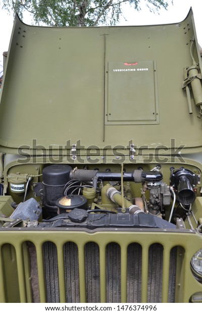 RUSSIA-KEMEROVO, 2019: American army off-road\
vehicle of the second world war Willys MB.Open the bonnet with\
inscription Lubricating order.Festival of retro cars in\
museum-reserve Tomsk\
Pisanitsa