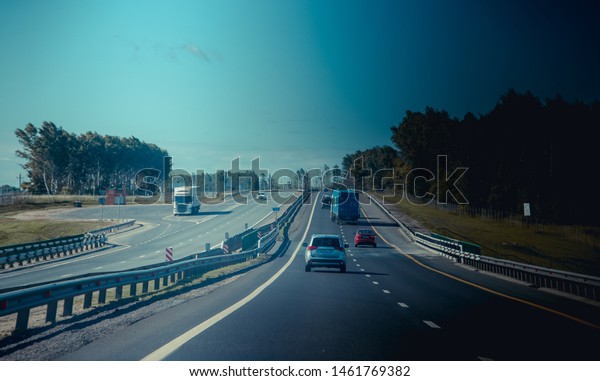 Russian\
automobile asphalt roads. Travel on the road. Cars on the road.\
Blue roads. Russia, Moscow Region July 3,\
2019