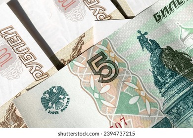 Russian banknotes. Money scattered on the surface - Shutterstock ID 2394737215