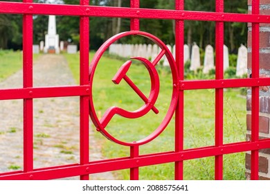 A Russian Cemetery Gate With Hammer And Sickle 