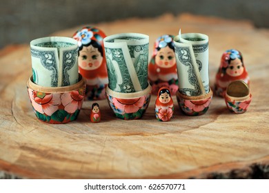 Russian Doll With Dollars Inside. Anti Crisis Money Box. Matrioska Bank.