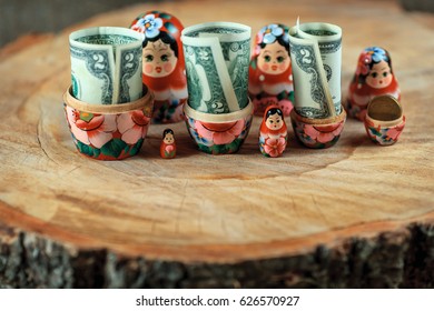 Russian Doll With Dollars Inside. Anti Crisis Money Box. Matrioska Bank.