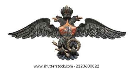 Russian double-headed coat of arms eagle, made from triggers, spherical bullets, and lock planks from flintlocks isolated on white background with clipping path