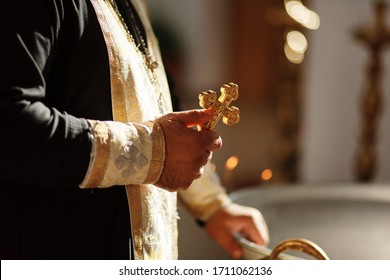 Russian Eastern orthodox church priest holds an orthodox cross in a hand. Close-up photo