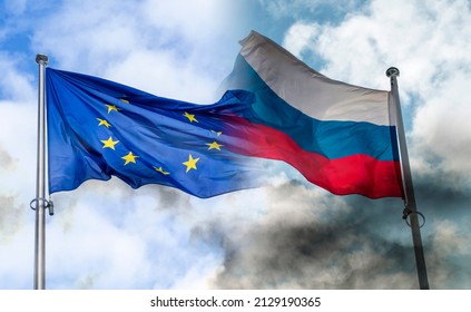 Russian and EU flags covered by black smoke, concept picture about sanctions and conflicts - Shutterstock ID 2129190365