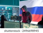 Russian expert working in high tech cyber operations center to collect information through malicious hacking attack. Russian federation spreading fake news and cyberwarfare propaganda.