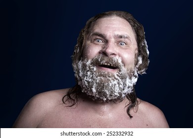 Russian Extreme: A Naked Man In The Snow With Frozen Beard And Hair In The Clouds Of Steam