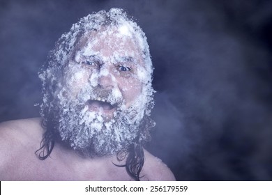 Russian Extreme: A Naked Man In The Snow With Frozen Beard And Hair In The Clouds Of Steam