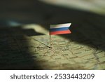 Russian federation flag on Russia map highlighted by dramatic light. High quality photo