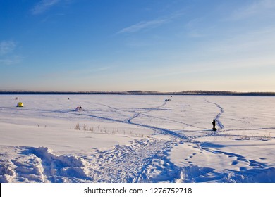 Russian Federation, Khanty-Mansi Autonomous Okrug – Yugra, Surgut, January 6, 2019: Ice Fisher's Shacks On The  Frozen Body Of The Ob River, Near The City Of Surgut.