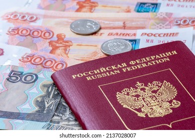 Russian Federation passport and Russian banknotes (rubles). Concepts of travel, economic sanctions, money transfers and inflation for citizens of Russia - Shutterstock ID 2137028007