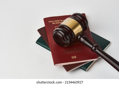 Russian Federation Passport And Judge Gavel On White Background. Legal Immigration Law. Obtain Citizenship Concept