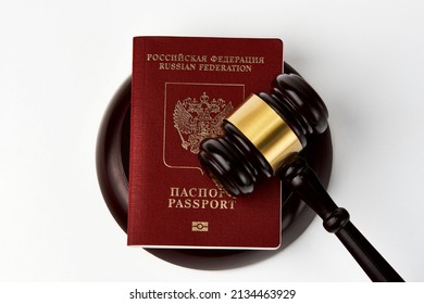 Russian Federation Passport And Judge Gavel On White Background. Legal Immigration Law. Obtain Citizenship Concept