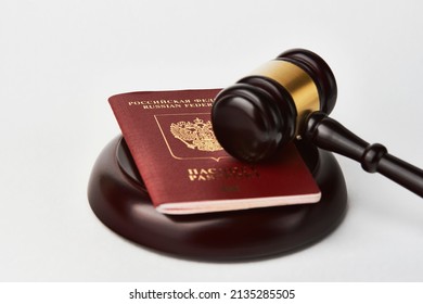 Russian Federation Passport And Judge Gavel On White Background. Legal Immigration Law. Obtain Citizenship Concept