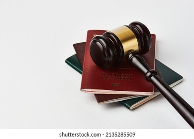 Russian Federation Passport And Judge Gavel On White Background. Legal Immigration Law. Obtain Citizenship Concept