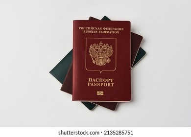 Russian Federation Passport And Judge Gavel On White Background. Legal Immigration Law. Obtain Citizenship Concept