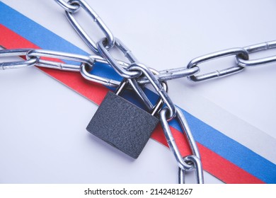Russian flag and chain. Closed borders of the state. Blocking countries and imposing sanctions.