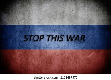 Russian flag on background wall with text 'STOP THIS WAR' referring to their current war with Ukraine. - Shutterstock ID 2131499573