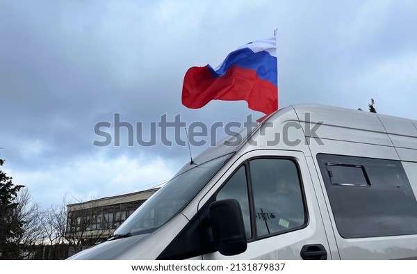 Russian Flag On the Car. Russian Symbol To Support\
Thier Politics. Russian News. Flag. Demonstration, March, 3,\
2022.Sevastopol, Crimea