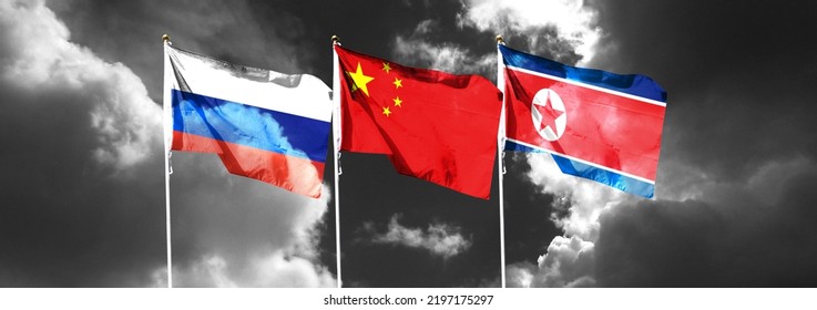 Russian Flag On Cloudy Sky With Chinese Flag And North Korean Flag. Waving In The Sky