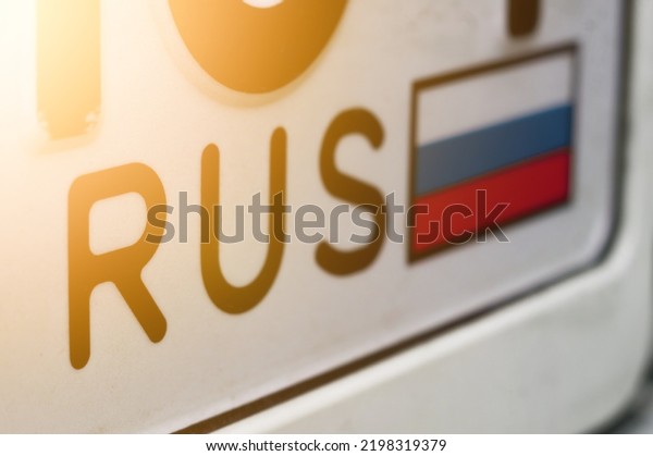 Russian flag on\
the registration number of the car. RUS region sign. License plate\
of the car. Selective\
focus