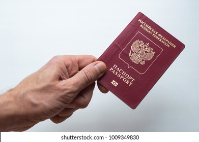 Russian foreign passport in the hand isolated on white background.