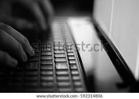 Russian hacker hacking the server in the dark Black and white