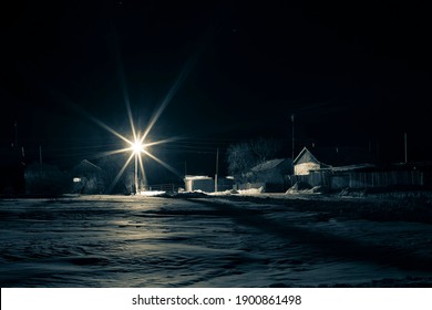 Russian Hut In A Remote Village At Night Against The Background Of Fog And The Moon