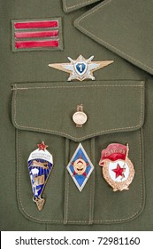 Russian Military Badges On The Green Uniform