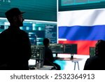 Russian military personnel in high tech government office spreading fake news and hybrid warfare propaganda, making threats. Russian army private stealing classified information from rivals.