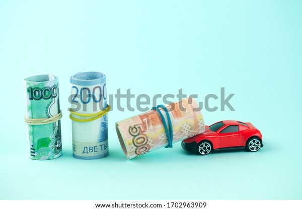 Russian\
money with a car, the concept of buying a\
car