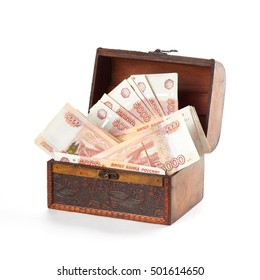A lot of russian money rubles in small wooden chest.