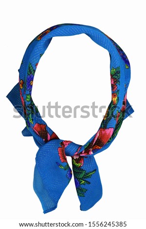 Russian national colorful headscarf isolated on a white background. Vintage blue headkerchief tied in babushka style