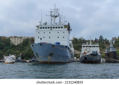 Russian Navy Ships In The Port Of Sevastopol. In The Background Is The Gray Sky. Russian Ships On Peaceful Combat Duty. Republic Of Crimea, October 4, 2010