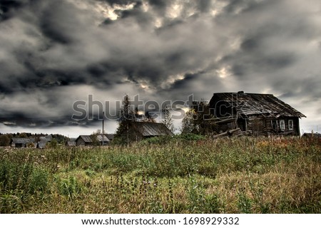 Russian old village on the edge of the forest is destroyed. North-West Russia, Wooden architecture of Karelians and Veps.