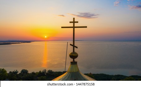 Russian orthodox lipovan church during sunrise next to a lake in Dobrogea Romania Sarichioi village