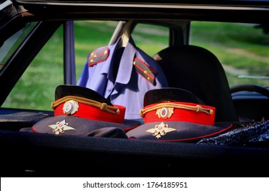 Russian Police Caps Are Lying In The Back Seat Of The Official Car