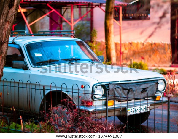 Russian retro car\
in the yard in the\
spring\
