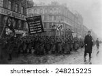 Russian Revolution. Funeral of 182 persons killed by Czarist police on Feb. 26, 1917. Crowd with banners in the street, St. Petersburg, Russia.